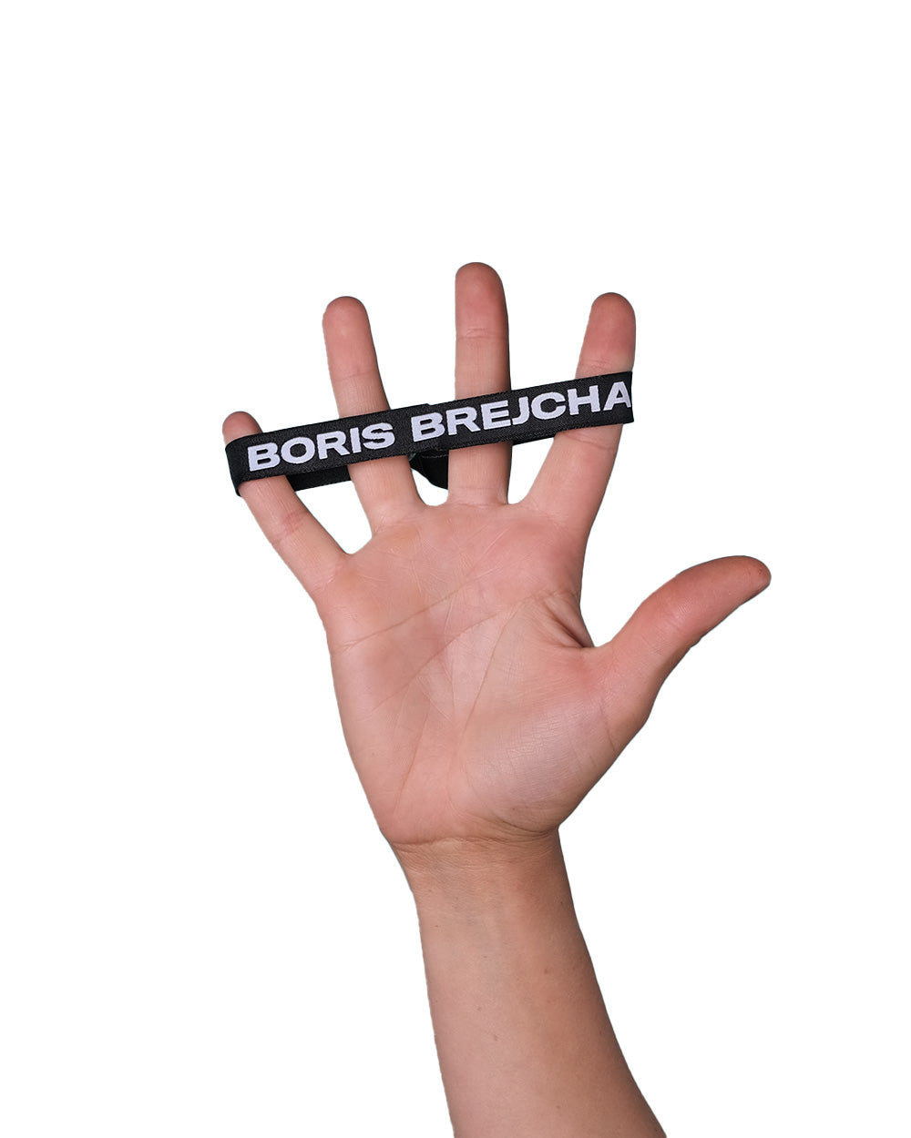 Hand stretches black wristband with "BORIS BREJCHA" printed in white across fingers.